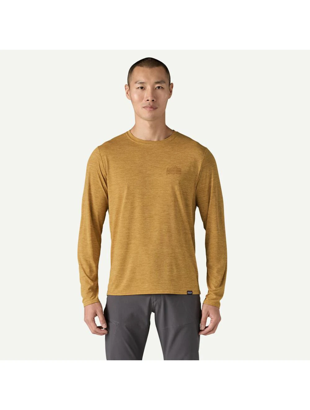 That is a Rash Guard Patagonia M's L/S Cap Cool Daily Graphic Shirt - waters Strataspire: Beeswax tan x-dye